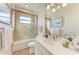 Bathroom featuring glass shower, quartz countertop, and stylish decor at 333 Santander Ct, Punta Gorda, FL 33950