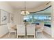 Stylish dining room with views of canal through bay window at 333 Santander Ct, Punta Gorda, FL 33950