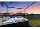 Outdoor hot tub overlooking a canal, offering a luxurious relaxation experience with a beautiful view at 333 Santander Ct, Punta Gorda, FL 33950