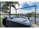Outdoor hot tub overlooking waterfront, providing a serene and luxurious experience at 333 Santander Ct, Punta Gorda, FL 33950