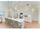 Modern kitchen with a large center island, stainless steel appliances, and stylish lighting at 333 Santander Ct, Punta Gorda, FL 33950