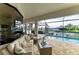 Inviting covered lanai with comfortable seating overlooking the pool and canal at 333 Santander Ct, Punta Gorda, FL 33950