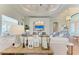 Cozy living room featuring a decorative fireplace, modern furniture, and ample natural light at 333 Santander Ct, Punta Gorda, FL 33950