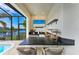Well-equipped outdoor bar area overlooking the pool and waterfront views at 333 Santander Ct, Punta Gorda, FL 33950