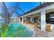 Inviting pool area featuring a covered patio with dining and seating, ideal for relaxation and enjoyment at 333 Santander Ct, Punta Gorda, FL 33950