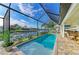 Inviting pool in a screened lanai with beautiful views of the waterfront and surrounding homes at 333 Santander Ct, Punta Gorda, FL 33950