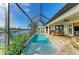 Beautiful screened-in pool with covered patio and waterfront view, perfect for outdoor entertaining at 333 Santander Ct, Punta Gorda, FL 33950