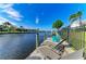 Picturesque waterfront with comfortable seating, offering stunning views and a relaxing atmosphere at 333 Santander Ct, Punta Gorda, FL 33950