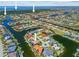 A stunning aerial view showcases the waterfront community with multiple homes on canals at 3335 Grenada Ct, Punta Gorda, FL 33950
