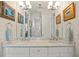 Bright bathroom features a double vanity with granite countertops, with an open doorway to the walk-in shower at 3335 Grenada Ct, Punta Gorda, FL 33950