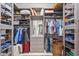 Organized walk-in closet with shelving, drawers, and hanging rods for ample storage space at 3335 Grenada Ct, Punta Gorda, FL 33950
