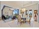 Bright dining area with seating for four and direct access to the outdoor living space and water views at 3335 Grenada Ct, Punta Gorda, FL 33950