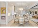 Open concept dining area with views into the kitchen and living spaces, perfect for entertaining guests at 3335 Grenada Ct, Punta Gorda, FL 33950