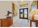 Elegant foyer with a grand entrance, beautiful artwork, and stylish decor at 3335 Grenada Ct, Punta Gorda, FL 33950
