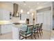 Bright kitchen features a large island with seating, stainless steel appliances, and ample white cabinetry at 3335 Grenada Ct, Punta Gorda, FL 33950