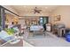 Relaxing lanai with a ceiling fan, comfortable seating, and views to kitchen and living area through sliding glass doors at 3335 Grenada Ct, Punta Gorda, FL 33950