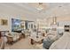 Spacious living room with a vaulted ceiling, stylish furnishings, and an open floor plan at 3335 Grenada Ct, Punta Gorda, FL 33950