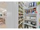 Organized pantry with ample storage, spices, and small appliances in the kitchen at 3335 Grenada Ct, Punta Gorda, FL 33950