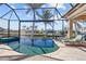Beautiful pool area with a spa, lounge chairs, and a scenic view of the canal at 3335 Grenada Ct, Punta Gorda, FL 33950