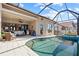Relaxing pool area with a covered lanai, and a summer kitchen, ideal for outdoor living at 3335 Grenada Ct, Punta Gorda, FL 33950