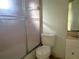 Bathroom featuring a toilet, bathtub with shower, and vanity at 410 Hinton St, Port Charlotte, FL 33954
