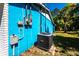 Outdoor view of the side of the house featuring the electrical box, meter, and air conditioning unit at 410 Hinton St, Port Charlotte, FL 33954