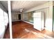 Enclosed patio with ceiling fan, refrigerator and view into the house at 410 Hinton St, Port Charlotte, FL 33954