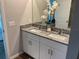 Bathroom boasts a dual sink vanity with a granite countertop at 43735 Cattleman Dr, Punta Gorda, FL 33982
