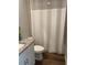 Bathroom featuring tiled floors, toilet, and shower with a curtain at 43735 Cattleman Dr, Punta Gorda, FL 33982