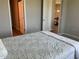 Bedroom with neutral paint and plush carpeting leading to an adjacent room at 43735 Cattleman Dr, Punta Gorda, FL 33982