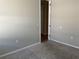 Bedroom with neutral paint, plush carpet, and a doorway leading to other rooms at 43735 Cattleman Dr, Punta Gorda, FL 33982
