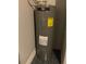 A close-up of a Ruud water heater showcasing its components and energy guide at 43735 Cattleman Dr, Punta Gorda, FL 33982