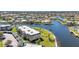 Waterfront condominium building features lush lawns, mature landscaping, and easy boat access at 601 Shreve St # 36C, Punta Gorda, FL 33950