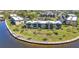 Waterfront condo complex featuring lush landscaping and picturesque views along the water's edge at 601 Shreve St # 36C, Punta Gorda, FL 33950