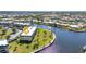 Stunning aerial view of waterfront condos with lush landscaping and picturesque water views at 601 Shreve St # 36C, Punta Gorda, FL 33950