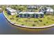 Aerial view of waterfront condos with verdant landscaping and tranquil water surroundings at 601 Shreve St # 36C, Punta Gorda, FL 33950