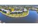 Aerial view of waterfront condos boasting meticulously manicured lawns and stunning water views at 601 Shreve St # 36C, Punta Gorda, FL 33950