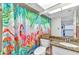 Bathroom featuring bright, colorful flamingo shower curtains, a granite countertop, and tiled floors at 601 Shreve St # 36C, Punta Gorda, FL 33950