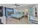 Bright bedroom with a ceiling fan, sliding door to the balcony, and a view at 601 Shreve St # 36C, Punta Gorda, FL 33950