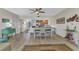 Dining area with seating for four, adjacent to the kitchen with barstool seating at the breakfast bar at 601 Shreve St # 36C, Punta Gorda, FL 33950