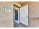Inviting entrance with an open door, welcome sign, and tiled floors at 601 Shreve St # 36C, Punta Gorda, FL 33950