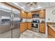 Well-lit kitchen features stainless steel appliances, wooden cabinetry and stylish granite countertops at 601 Shreve St # 36C, Punta Gorda, FL 33950