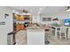 Updated kitchen with stainless steel appliances, custom cabinets, and granite countertops at 601 Shreve St # 36C, Punta Gorda, FL 33950