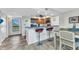 Open floorplan provides seating at the kitchen bar, with views of the dining and living areas at 601 Shreve St # 36C, Punta Gorda, FL 33950