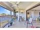 Screened-in lanai offering beautiful waterfront views, complete with comfortable seating and access to living area at 601 Shreve St # 36C, Punta Gorda, FL 33950