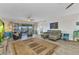 Spacious living room featuring modern furniture, a ceiling fan, and a sliding glass door to the lanai at 601 Shreve St # 36C, Punta Gorda, FL 33950