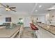 Open floor plan showcasing a breakfast bar overlooking dining and living areas with access to balcony at 601 Shreve St # 36C, Punta Gorda, FL 33950