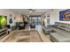 Bright living room with hardwood floors, comfortable seating, and access to the balcony at 601 Shreve St # 36C, Punta Gorda, FL 33950