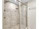 Shower featuring neutral-colored tile, glass door, and dual shower heads at 601 Shreve St # 36C, Punta Gorda, FL 33950