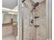Shower area featuring a built-in niche, hand-held wand and view of the bathroom vanity at 601 Shreve St # 36C, Punta Gorda, FL 33950